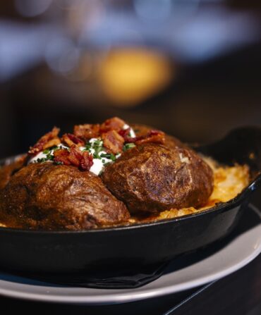 A baked potato in a dish