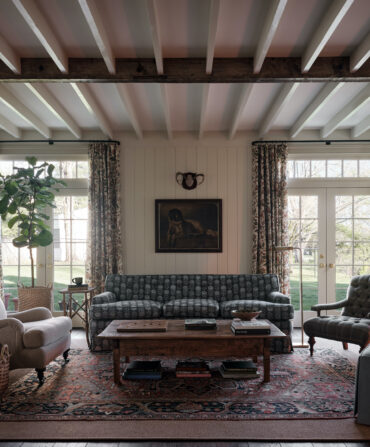 A living room with exposed beam ceiling details