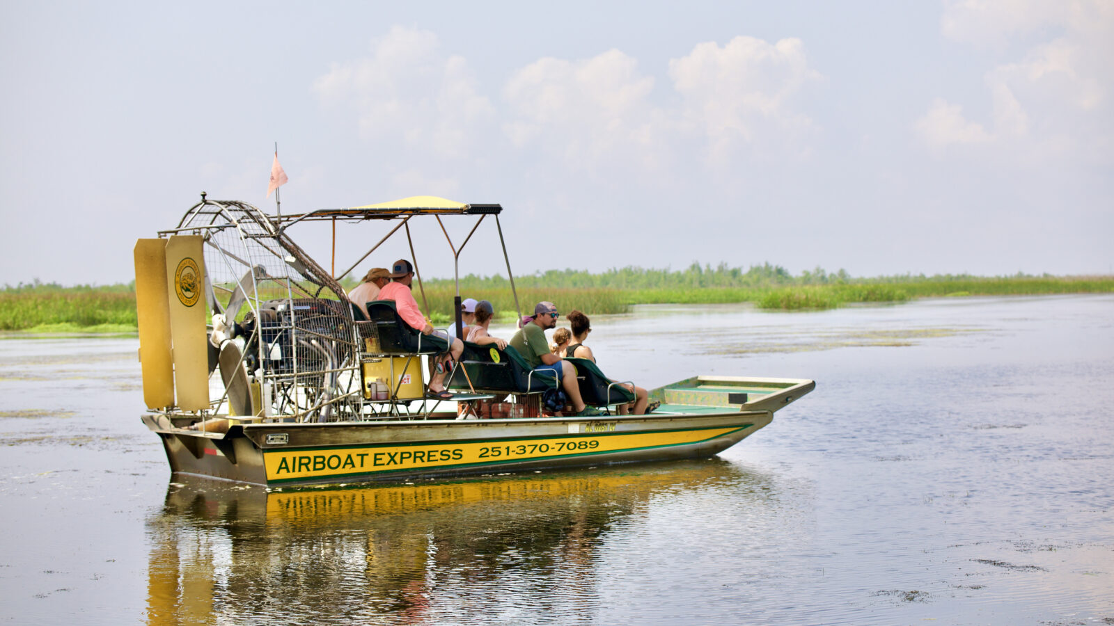 People ride around on an airboat