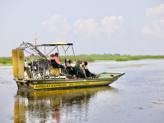 People ride around on an airboat