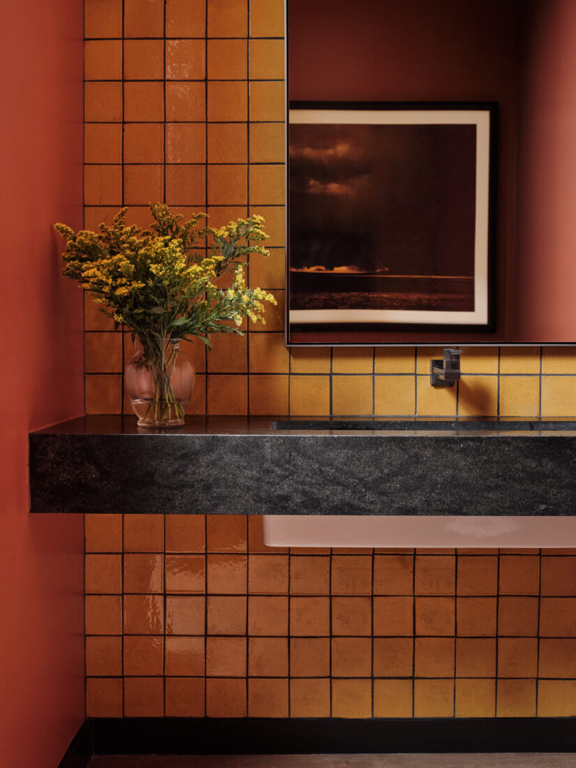An orange tiled bathroom