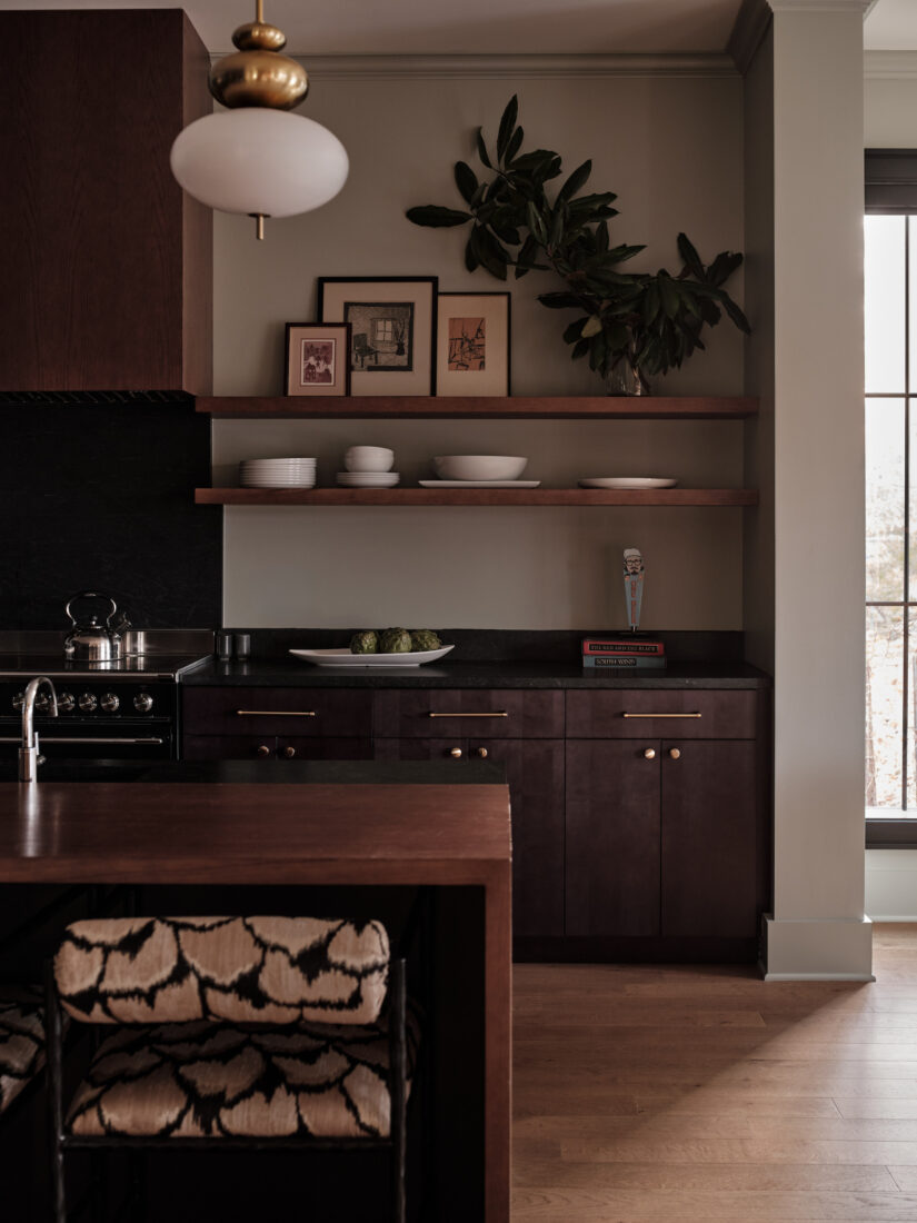 A kitchen with dark stained wood cabinets