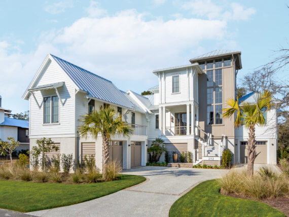 A white house with palm trees