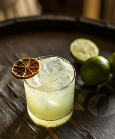 A margarita with a dehydrated lime