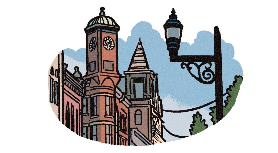 An illustration of a town skyline with an iron street light and spired buildings