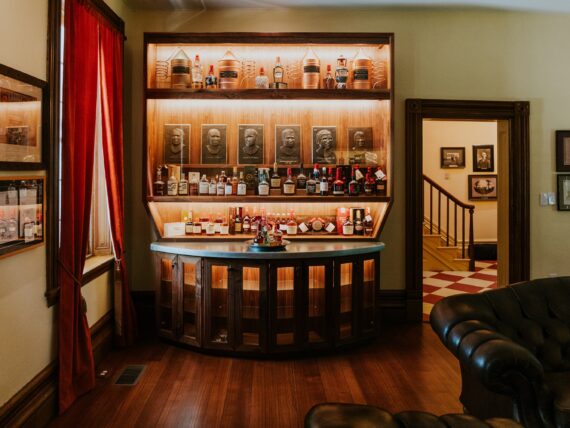 Inside a bourbon museum with shelves of bottles