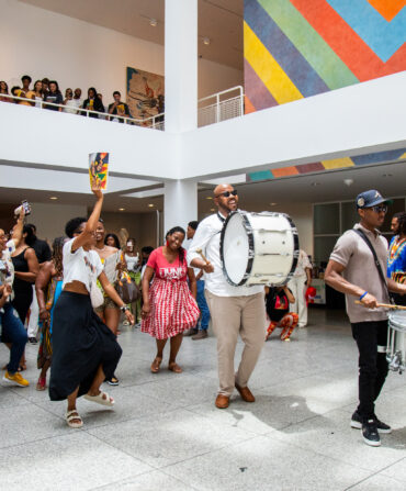 People dancing in a museum