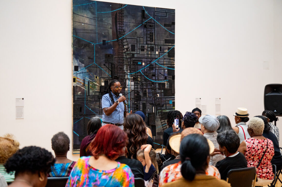 A man giving a presentation in a museum