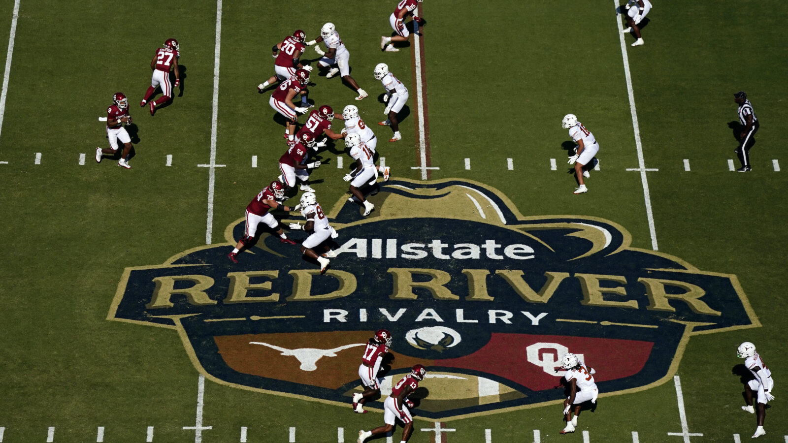 Football players play on a field