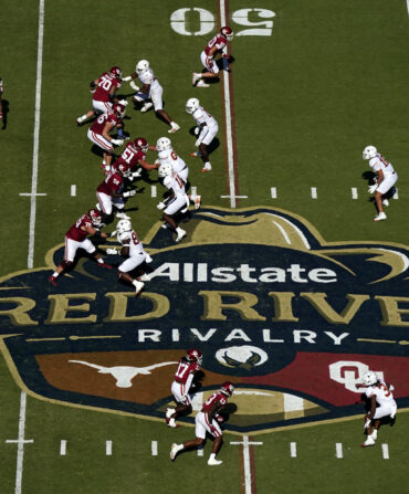 Football players play on a field