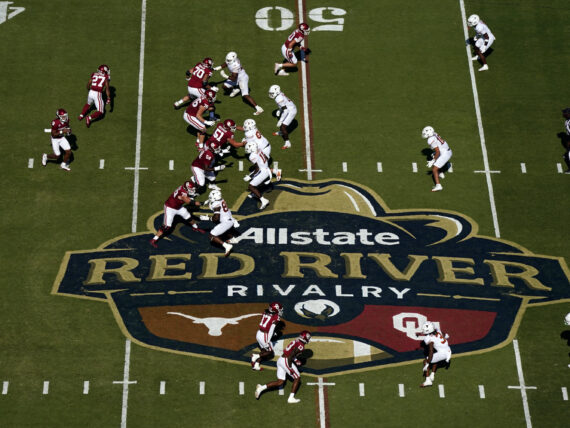 Football players play on a field