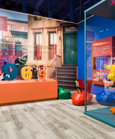 A museum exhibit featuring puppets from Sesame Street