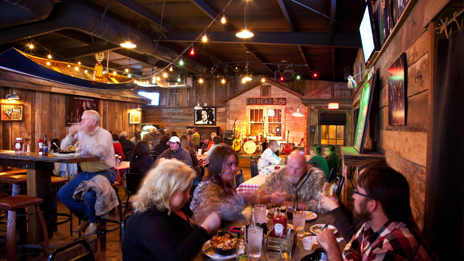Inside a wood-covered restaurant and juke joint