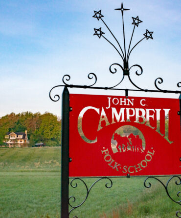 A red sign in a mountain landscape
