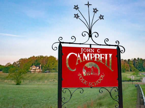 A red sign in a mountain landscape