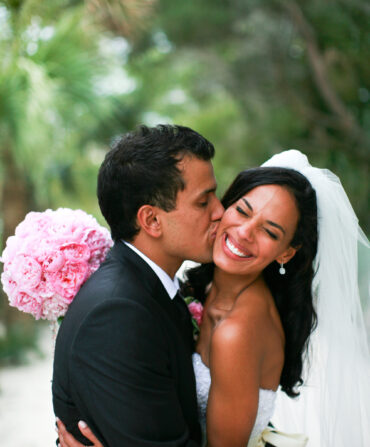 A bride and groom embrace
