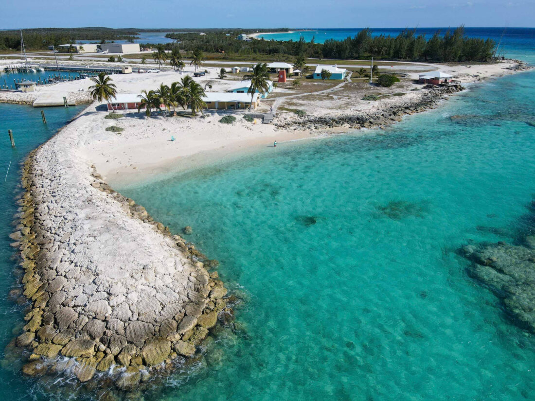 A lodge on a white sand beach