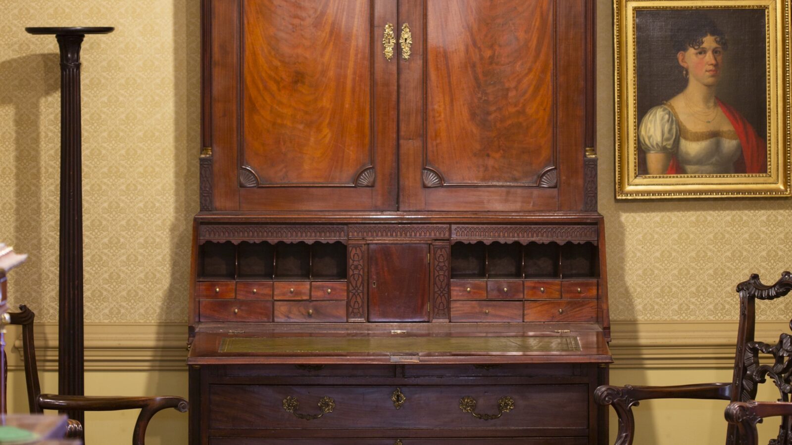 An antique desk and chair