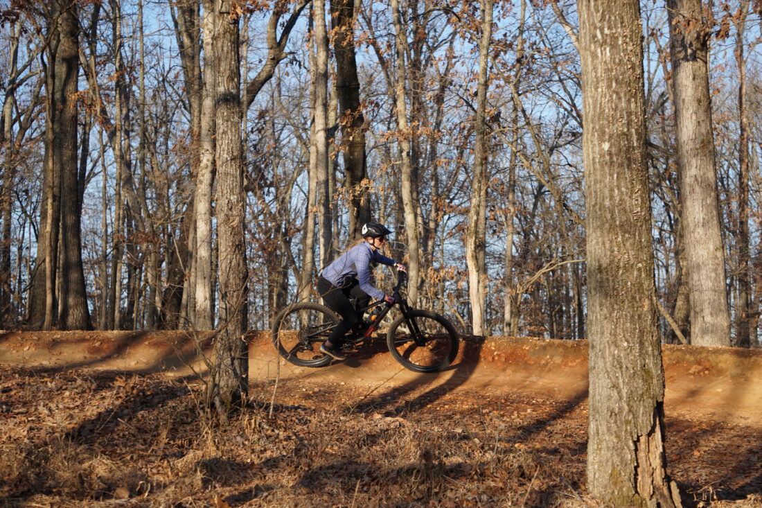 A woman mountain biking