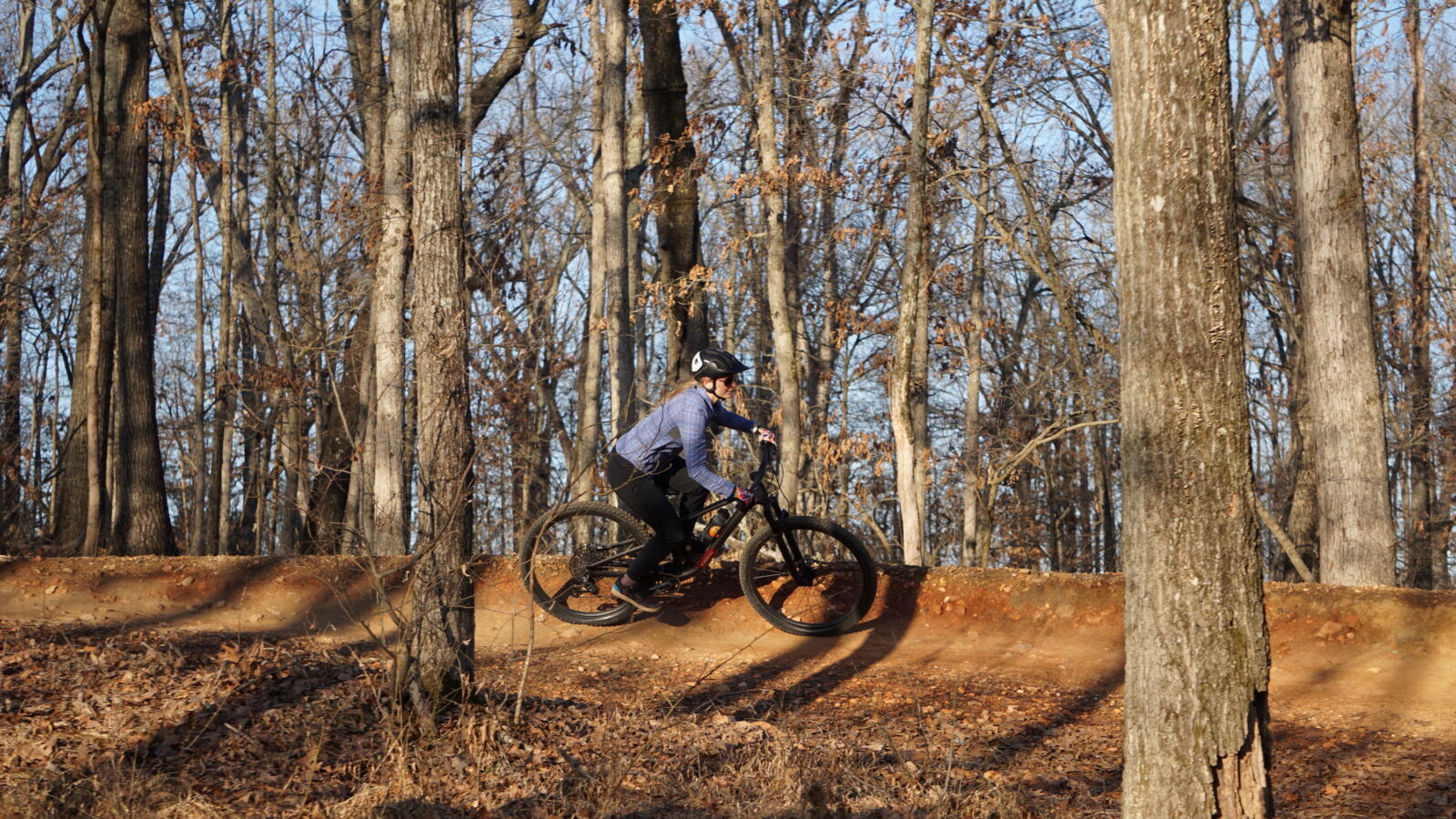 A woman mountain biking