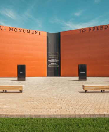 A wall-shaped monument, inscribed with approximately 122,000 names