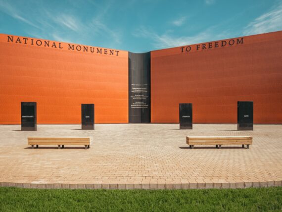 A wall-shaped monument, inscribed with approximately 122,000 names