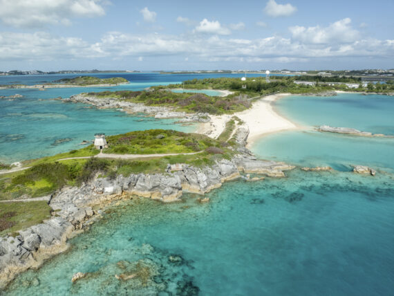 An island with white sand beaches and clear water