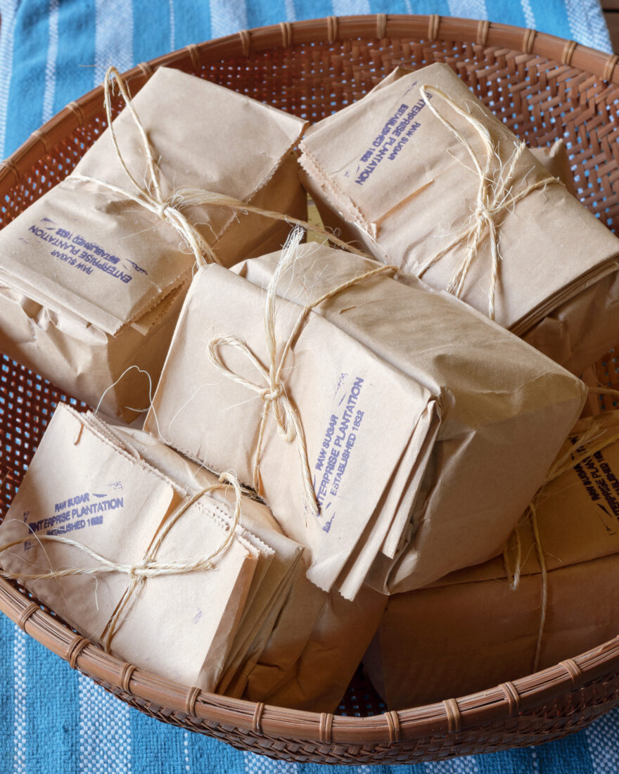 Packages of gift sugar wrapped and set in a basket