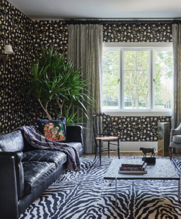 A floral patterned wallpaper in a sitting room