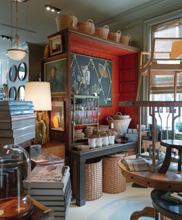 Inside a shop with glassware and hampers