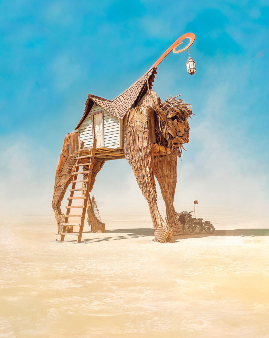 A large wood sculpture of a bison