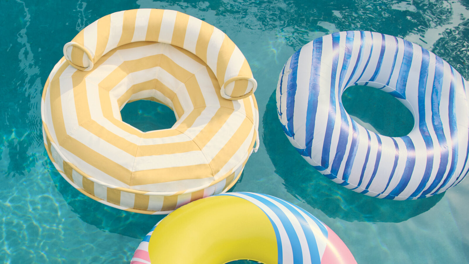 A collection of three pool floats