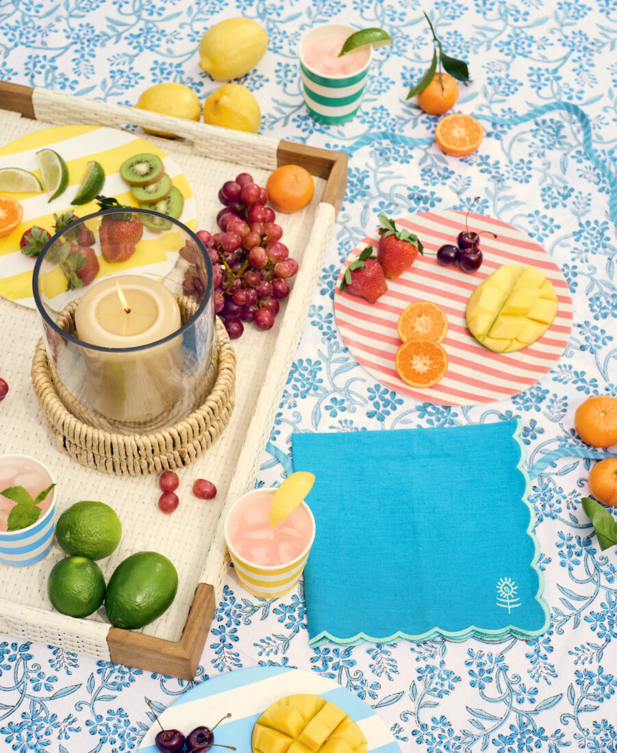 A spread of fruit on a floral tablecloth