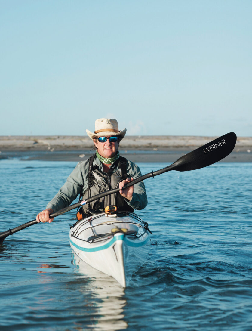 A man paddles in a kayak