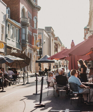 A street with outdoor dining in a downtown