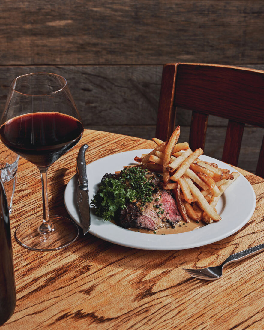 A plate of steak and fries