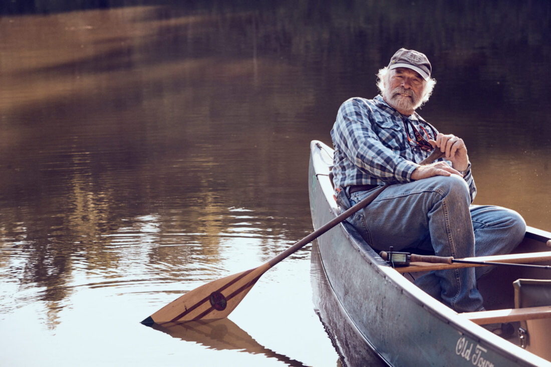 A man sits in a boat