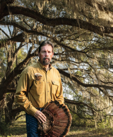 Portrait of Chamberlain in front of an oak tree