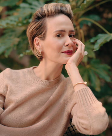 A woman with her hand under her chin