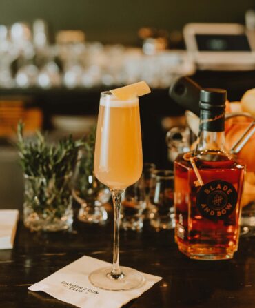 An orange cocktail in a glass