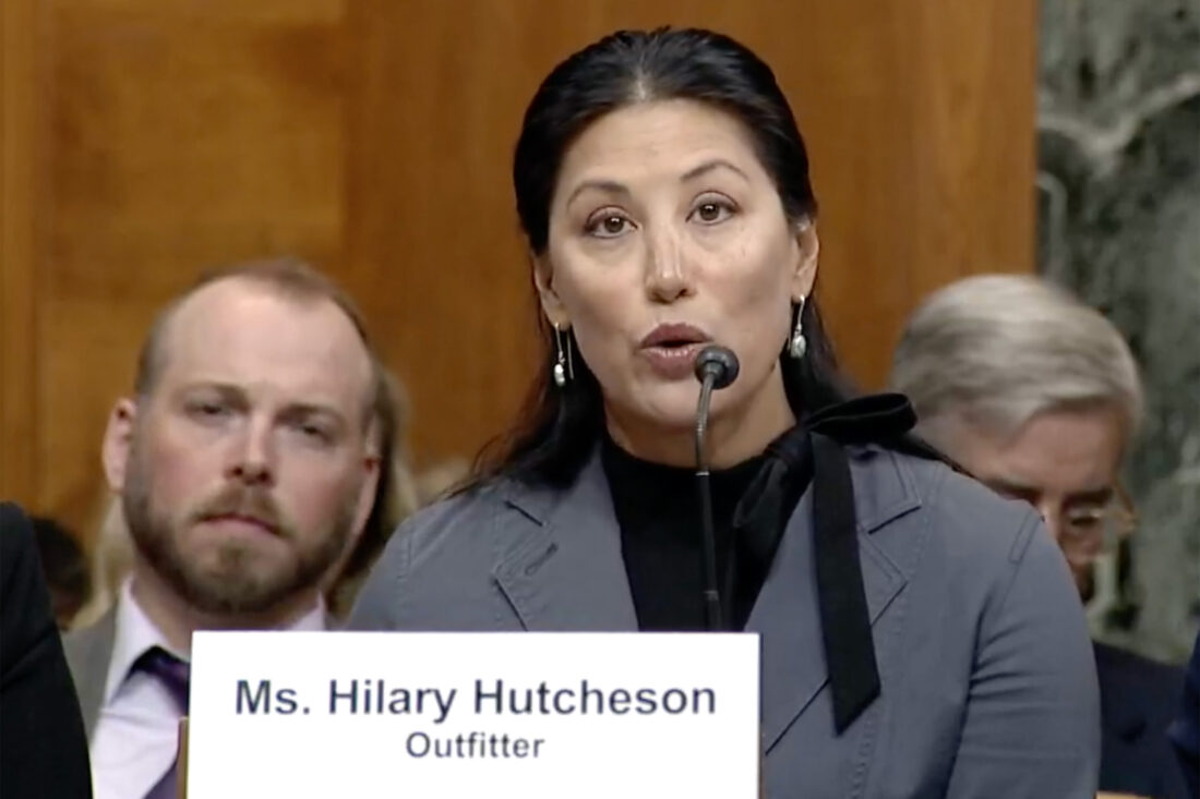 A woman speaking into a microphone