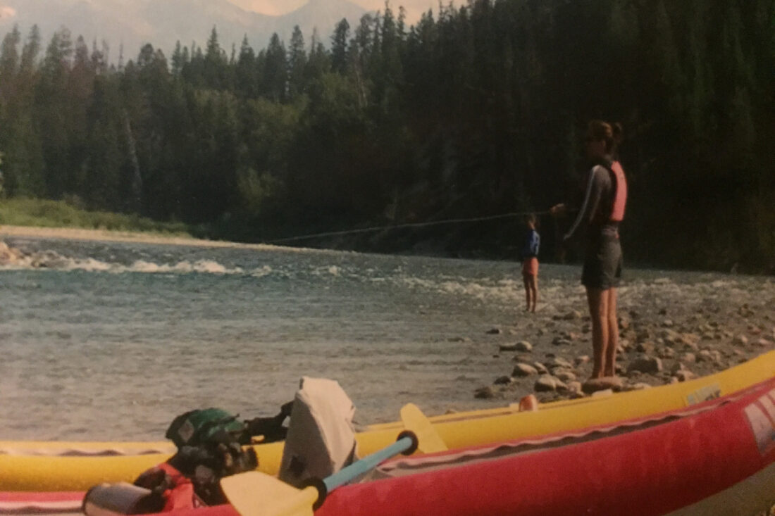 Two women fishing a river
