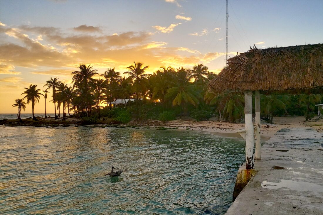The sun sets on a Caribbean beach