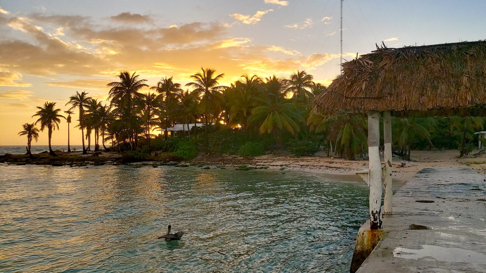 The sun sets on a Caribbean beach