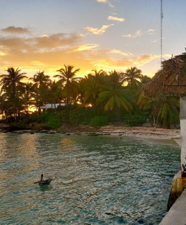 The sun sets on a Caribbean beach