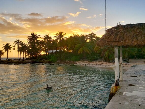 The sun sets on a Caribbean beach