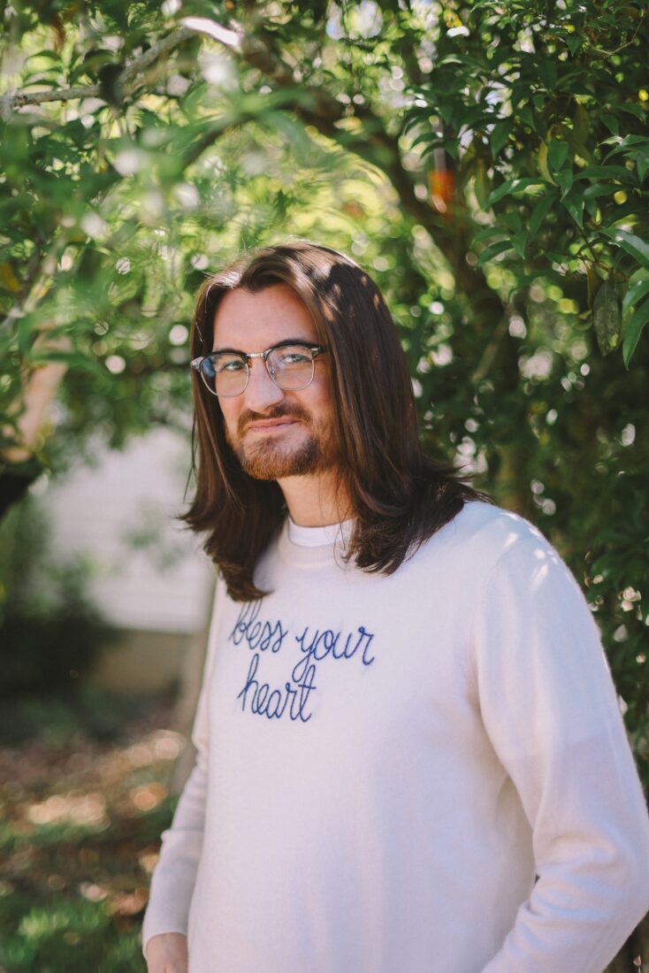 A portrait of a man under a tree