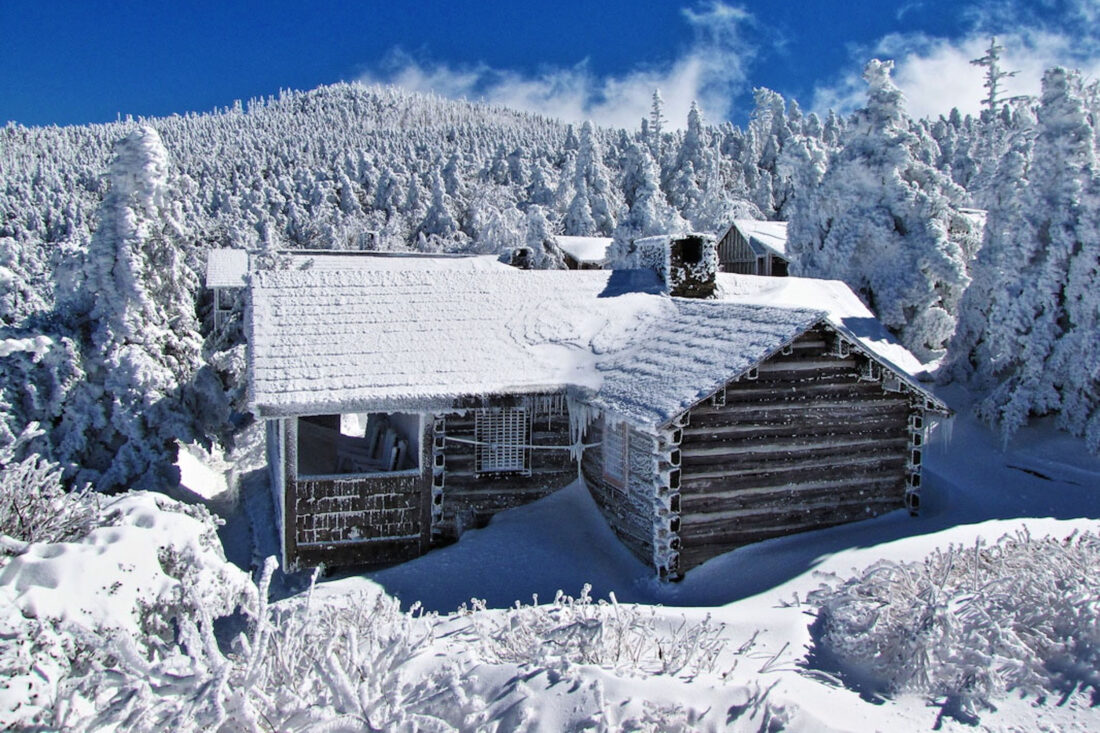A snowy lodge in a mountain landscape