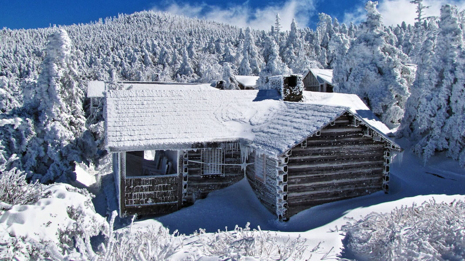 A snowy lodge in a mountain landscape