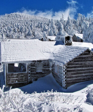 A snowy lodge in a mountain landscape
